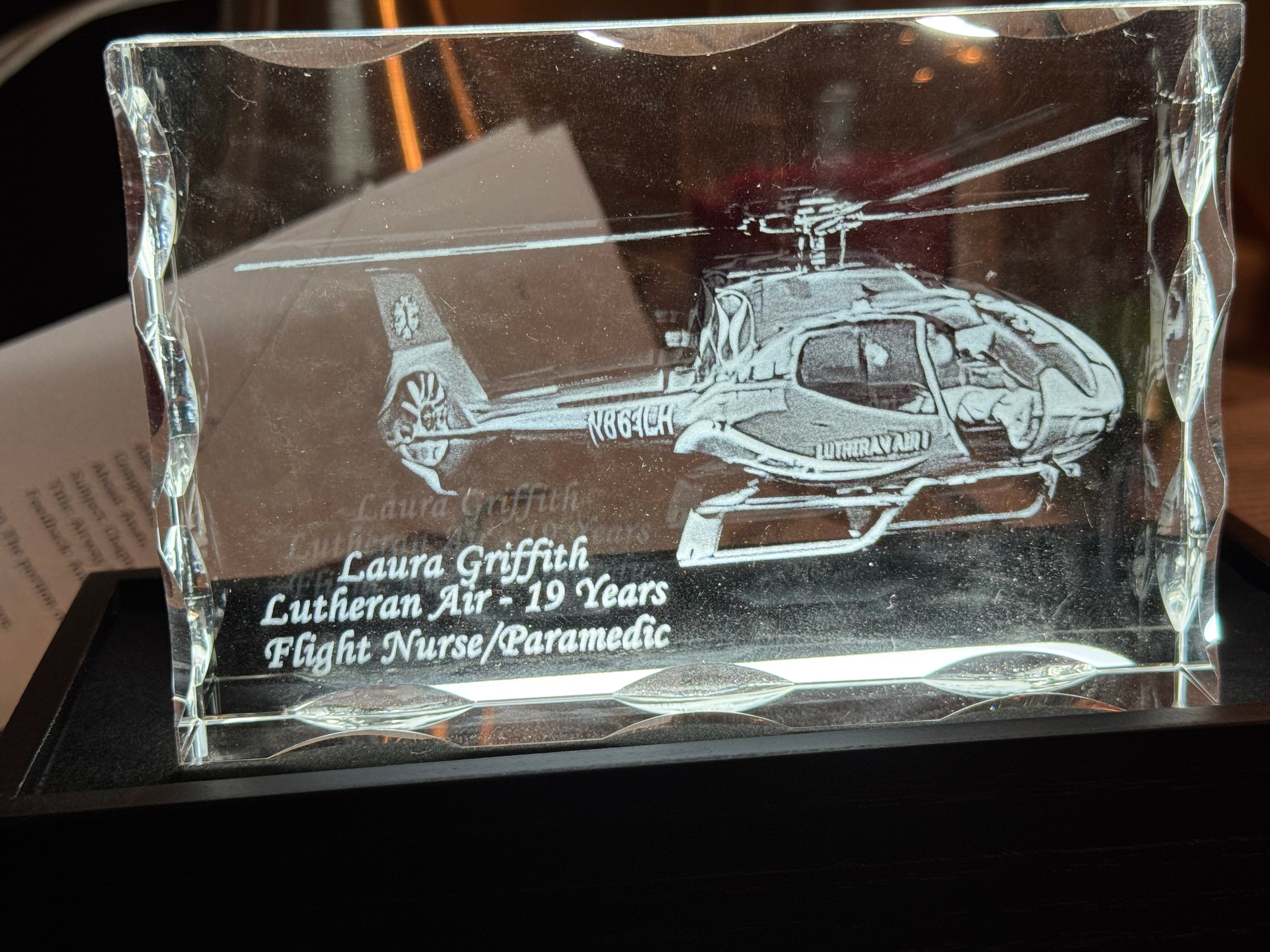 Personalized 3D crystal tribute with engraved name on premium wood LED base